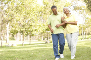 Senior Couple Walking In Park